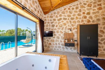 Kalkan'da 2 Yatak Odalı Jakuzili Villa-Villa Seabird - image 25